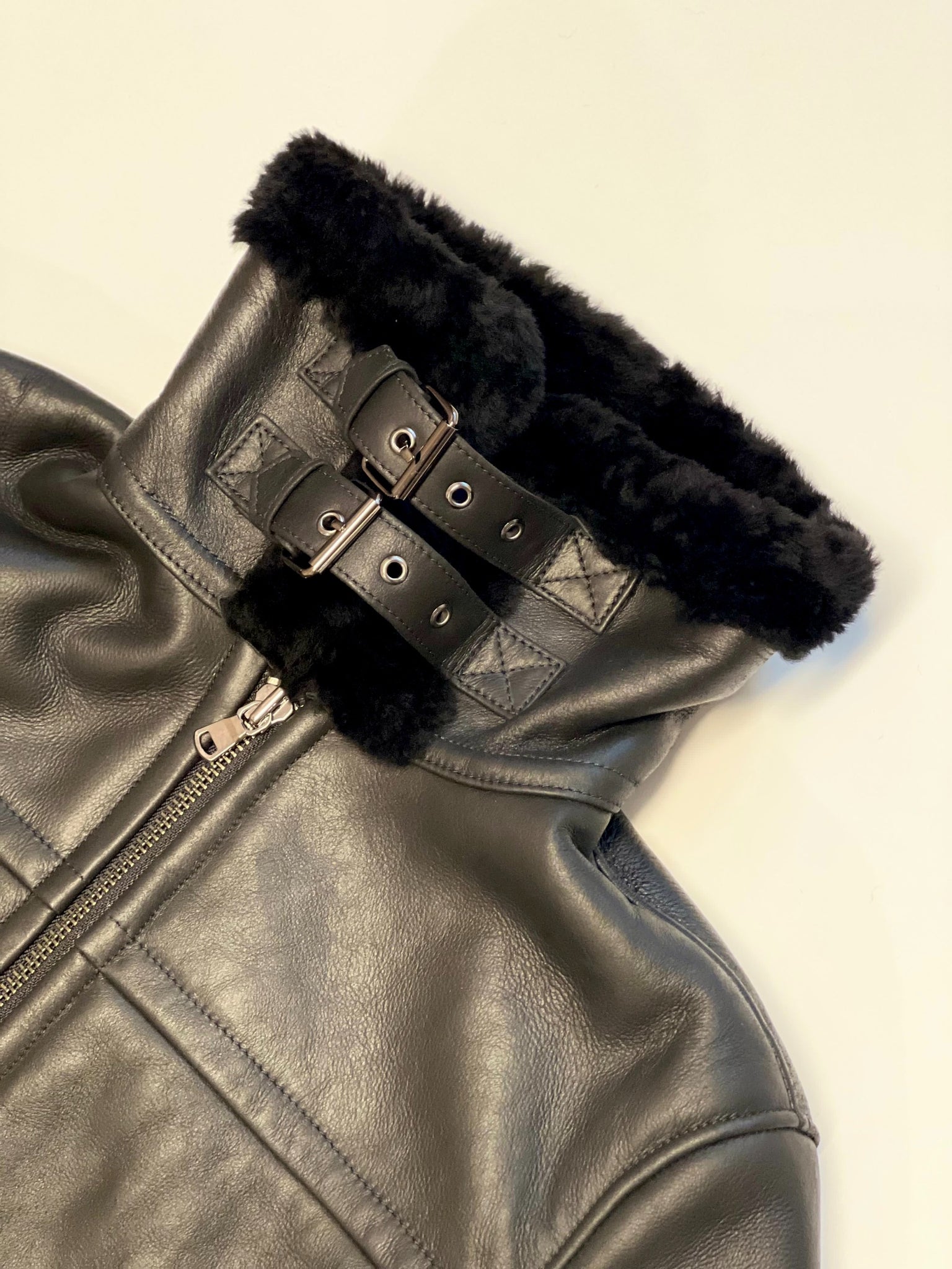 BLACK LEATHER-TRIMMED SHEARLING JACKET